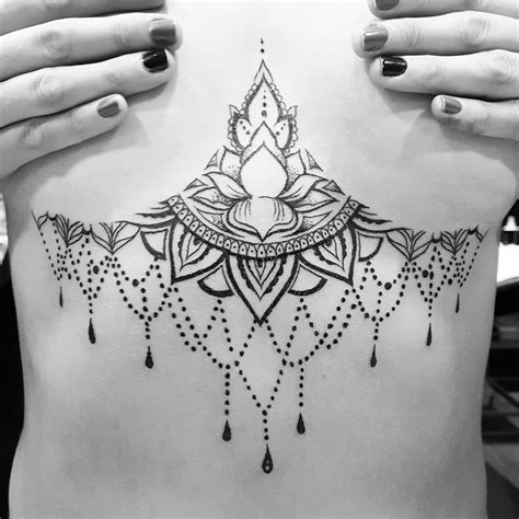 lower boob tattoo|Beautiful Lower Breast Tattoos for Women at Mantra。